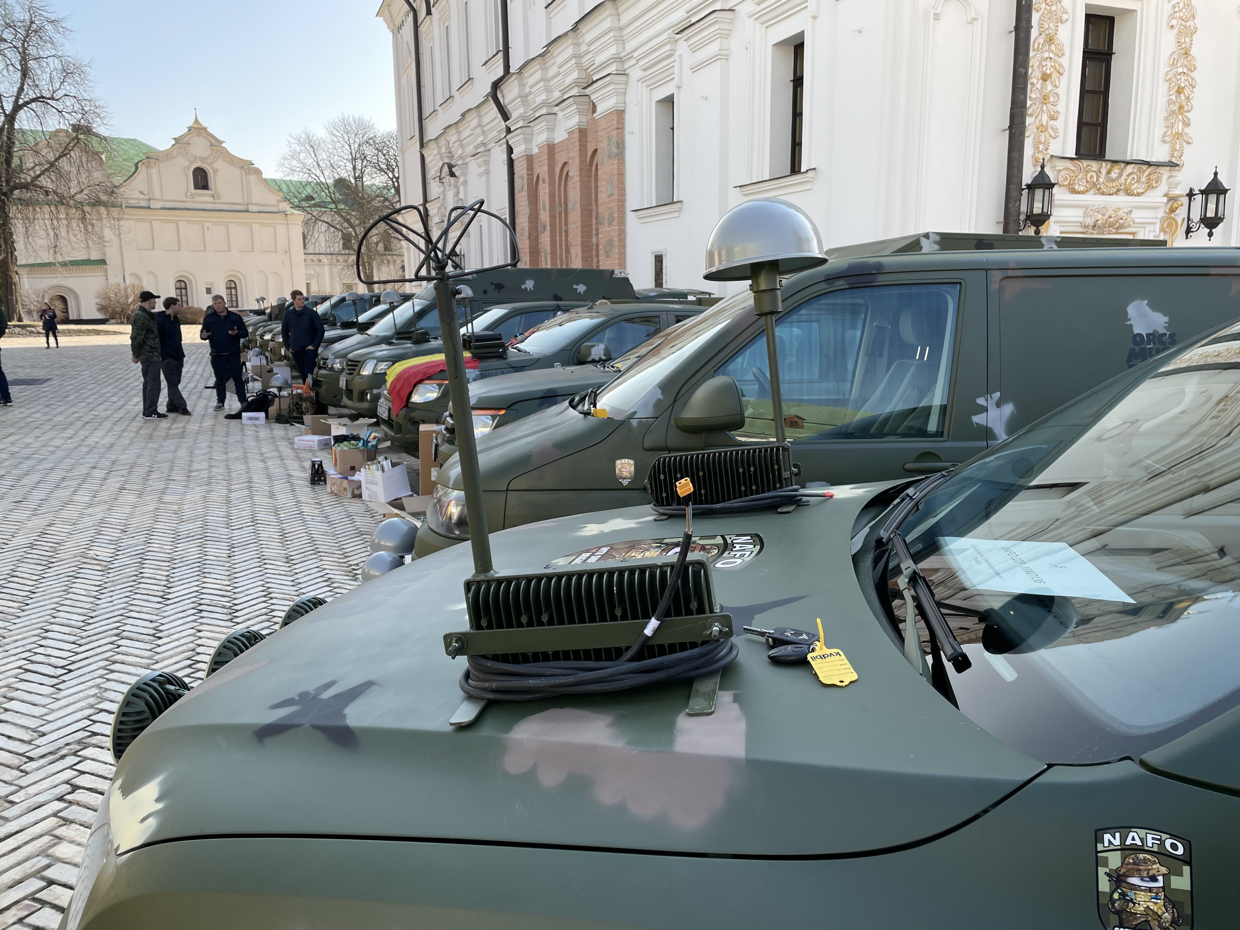 Anti Drone Jammers on the bonnet of a vehicle, with a line of vehicles in the background.