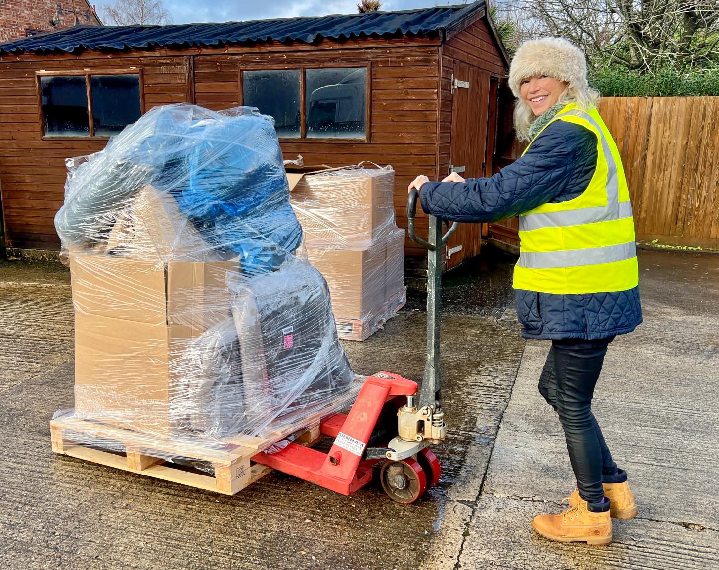 Emma moves donations ready to be shipped off to pets in need. Image credit: Emma Williams
