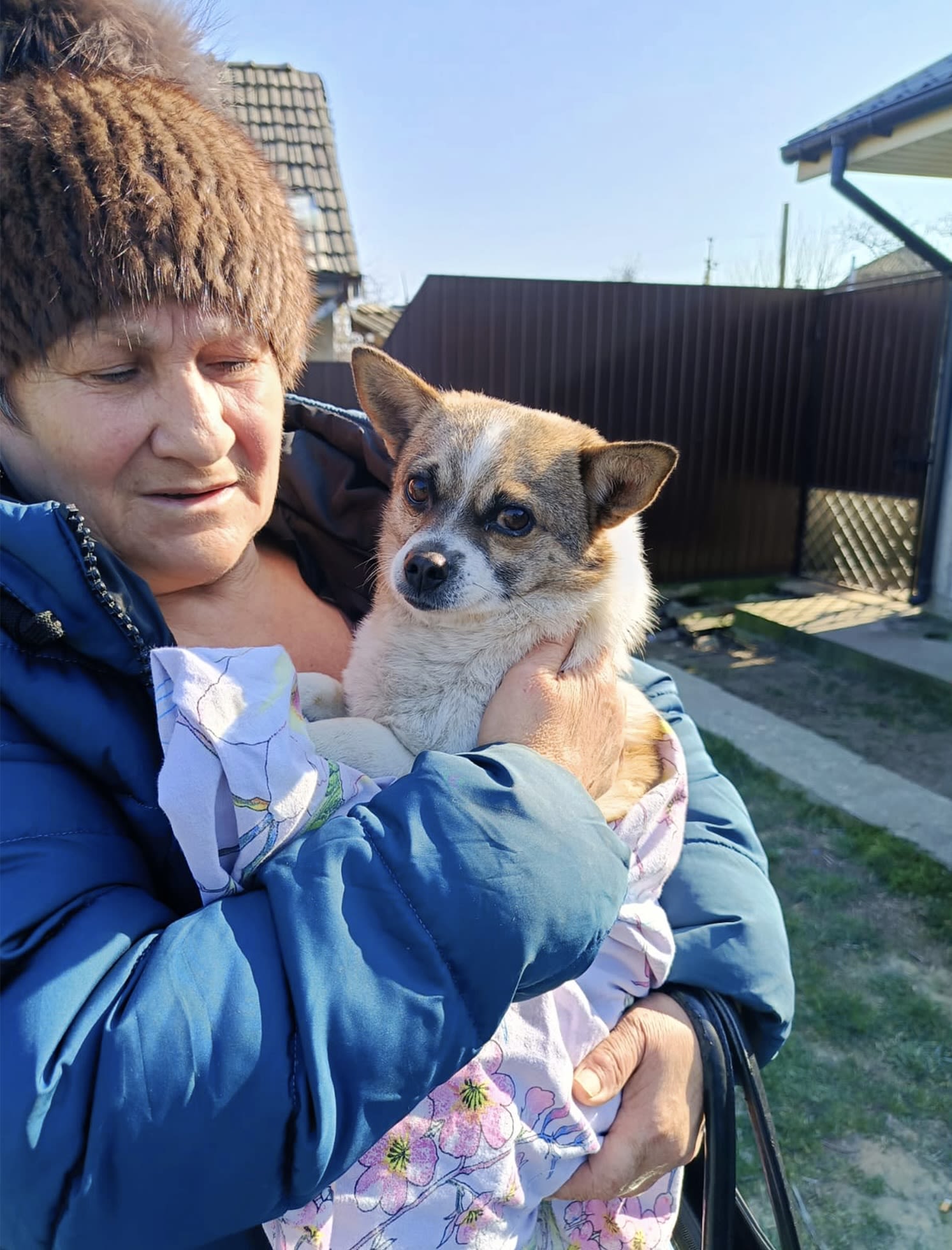 A worried owner holds her beloved canine while waiting to be spayed at one of K9's spay events for low income families. Image credit: K9 Rescue International